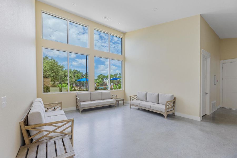 A spacious common area with soaring windows offers inviting pool and garden views. A spacious common area with soaring windows offers inviting pool and garden views.