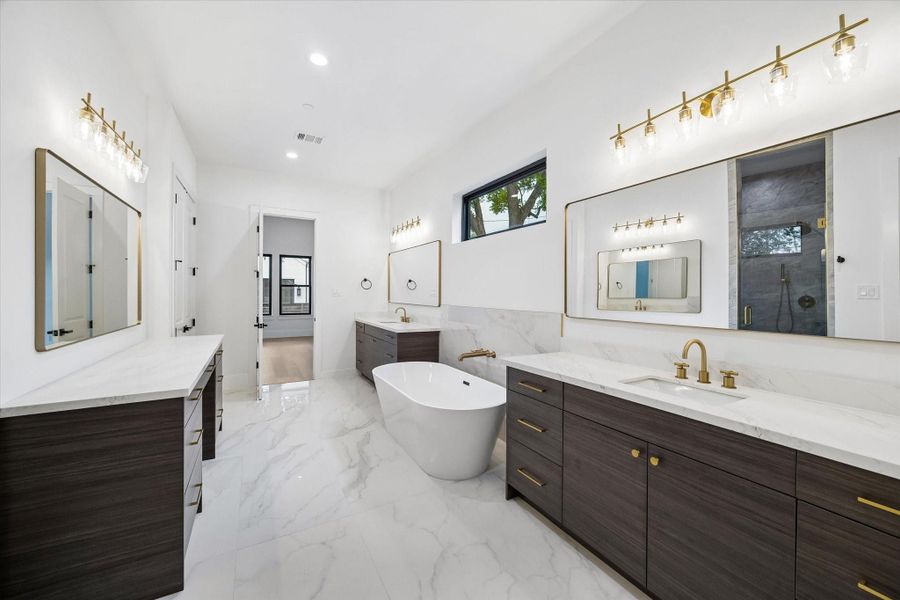 To assist with the morning rush, the Bath is wide and spacious. In addition to two separate vanities there is a third with knee space to get ready for the day.