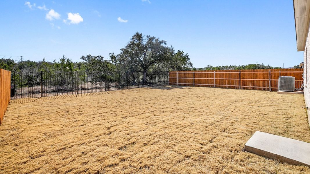 Exterior details and patio area of a home in Thunder Rock, Marble Falls (Image 18).