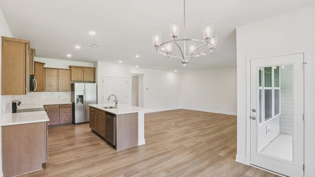 Pendleton home plan open concept kitchen, breakfast area and living room