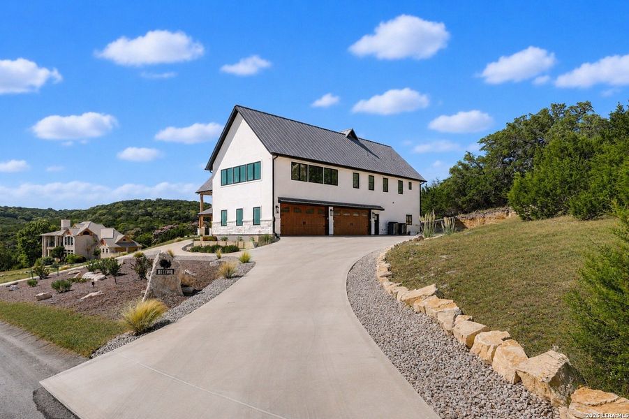 Front exterior of a new home in , Boerne, TX, highlighting curb appeal (Image 27). Front exterior of a new home in , Boerne, TX, highlighting curb appeal (Image 27).