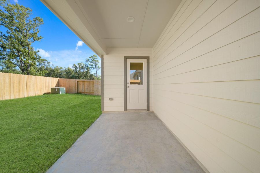 Exterior details and patio area of a home in Cypresswood Landing, Humble (Image 18).