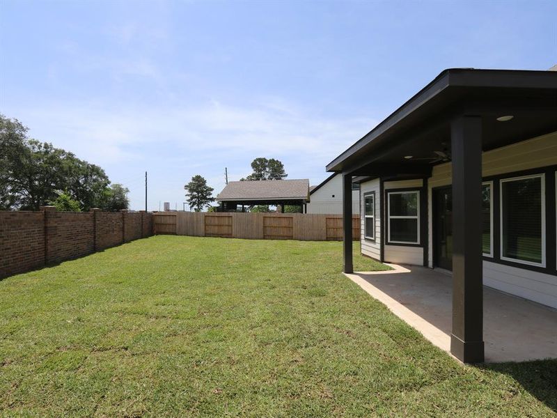 Front exterior of a new home in Summerview, Fulshear, TX, highlighting curb appeal (Image 14). Front exterior of a new home in Summerview, Fulshear, TX, highlighting curb appeal (Image 14).