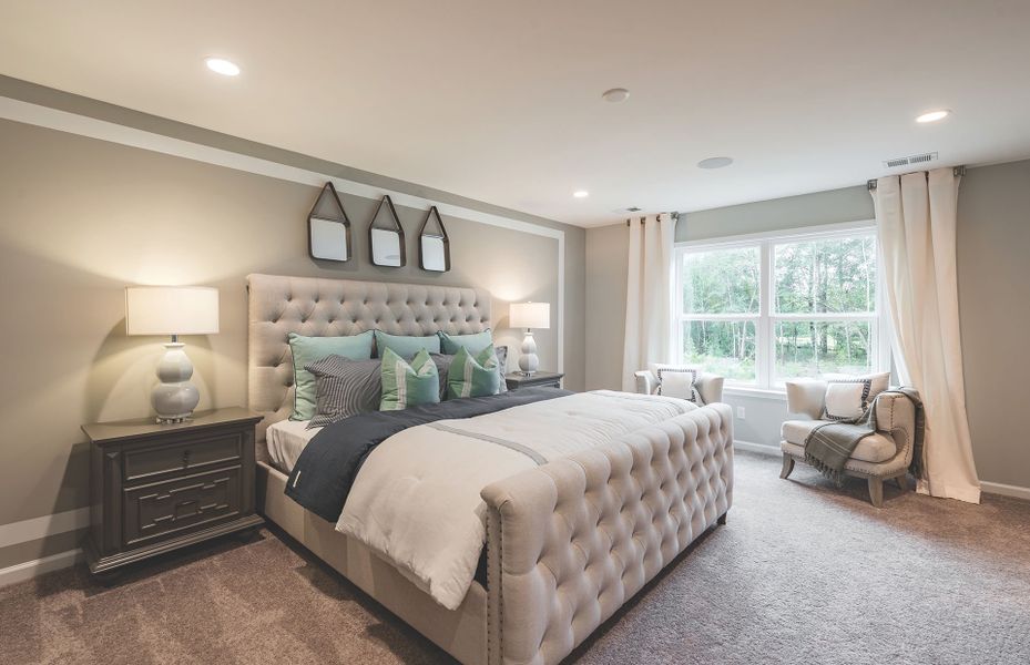 An elegant Owner's Suite with space to relax