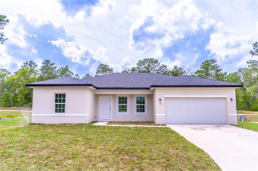 Front exterior of a new home in , Ocala, FL, highlighting curb appeal (Image 14).