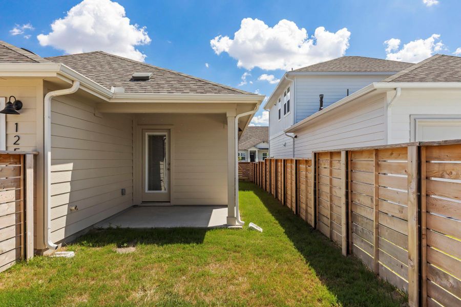 Front exterior of a new home in Flora, Hutto, TX, highlighting curb appeal (Image 1). Front exterior of a new home in Flora, Hutto, TX, highlighting curb appeal (Image 1).