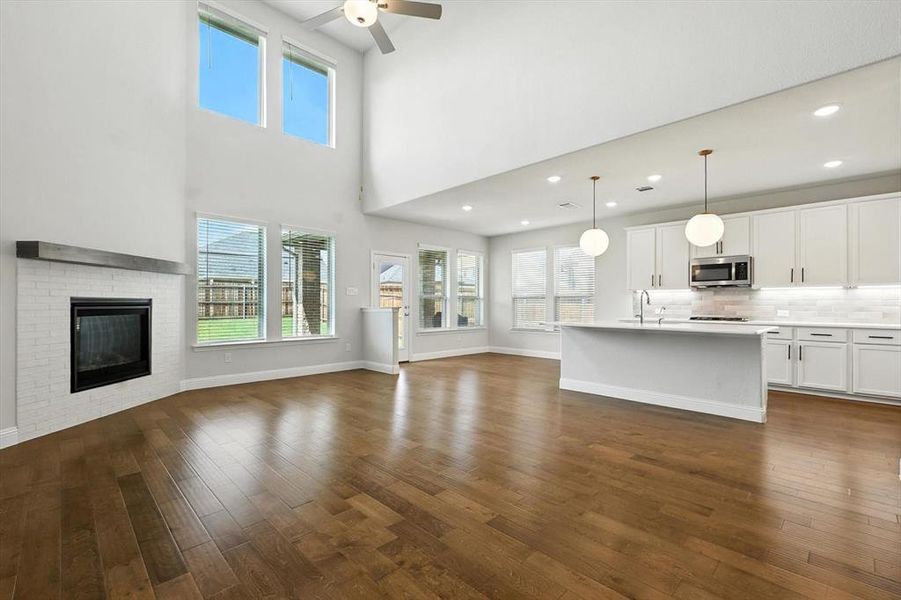 Massive living space with natural lights, remote shades/window coverings.