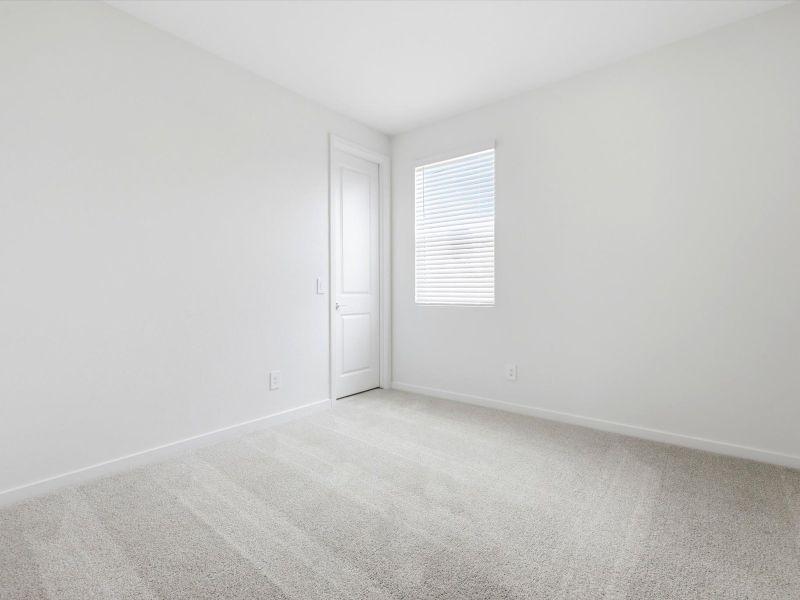 Spacious, unfurnished interior of a new home in White Tank Foothills Signature Series, Waddell (Image 16).