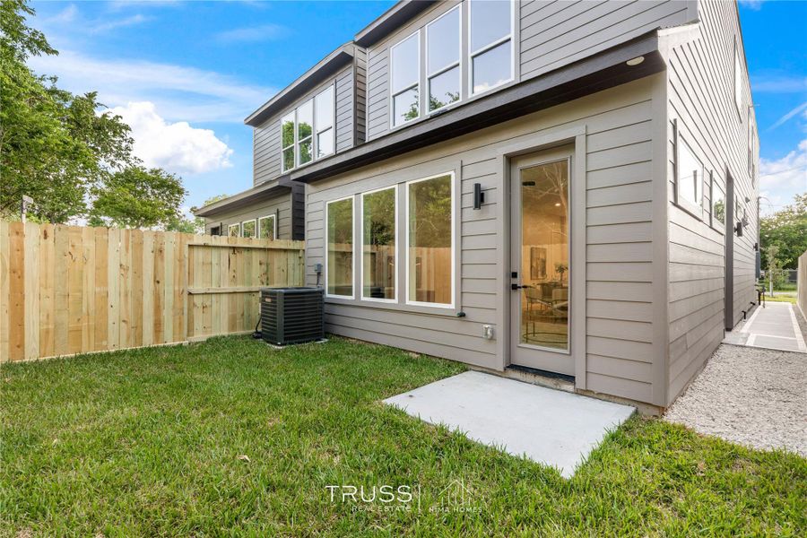 A fenced private yard extends the home’s lifestyle outdoors, perfect for weekend grilling or quiet coffee mornings.