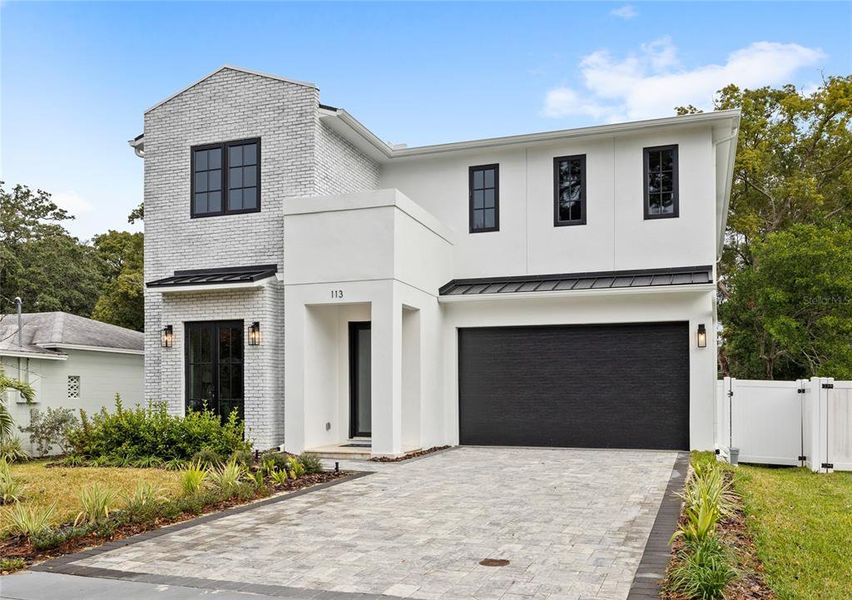 Front exterior of a new home in College Park, Orlando, FL, highlighting curb appeal (Image 1). Front exterior of a new home in College Park, Orlando, FL, highlighting curb appeal (Image 1).