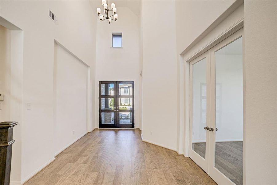 Upon entry, you will find sky-high ceilings and a grand foyer!