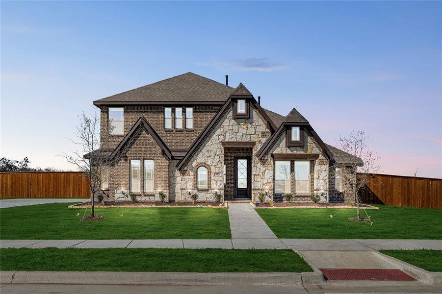 Front exterior of a new home in Glenbrook, Red Oak, TX, highlighting curb appeal (Image 2).