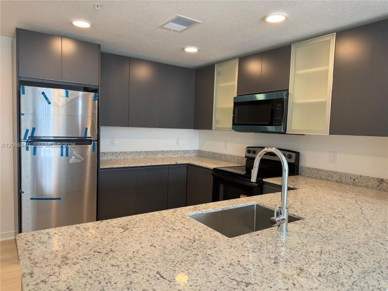 Full Equipped Kitchen - Modern new construction featuring brand-new appliances throughout.