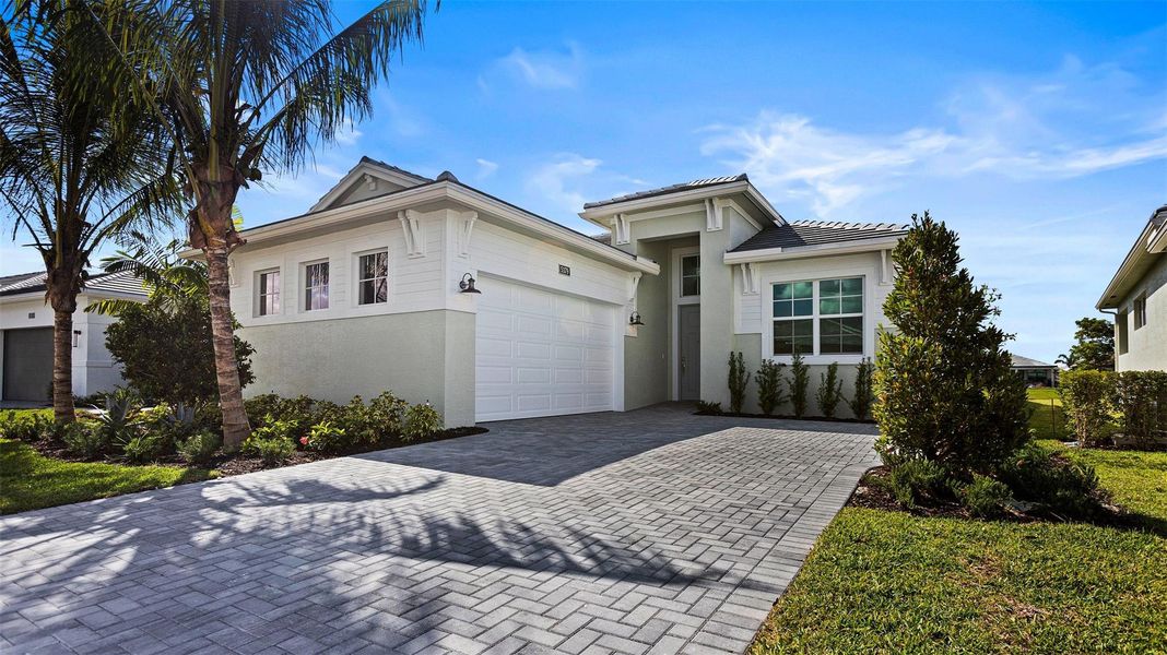 Front exterior of a new home in , Westlake, FL, highlighting curb appeal (Image 21).
