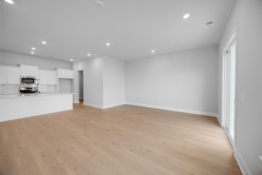 Spacious, unfurnished interior of a new home in Carnes Crossroads: Villas Collection, Summerville (Image 9).