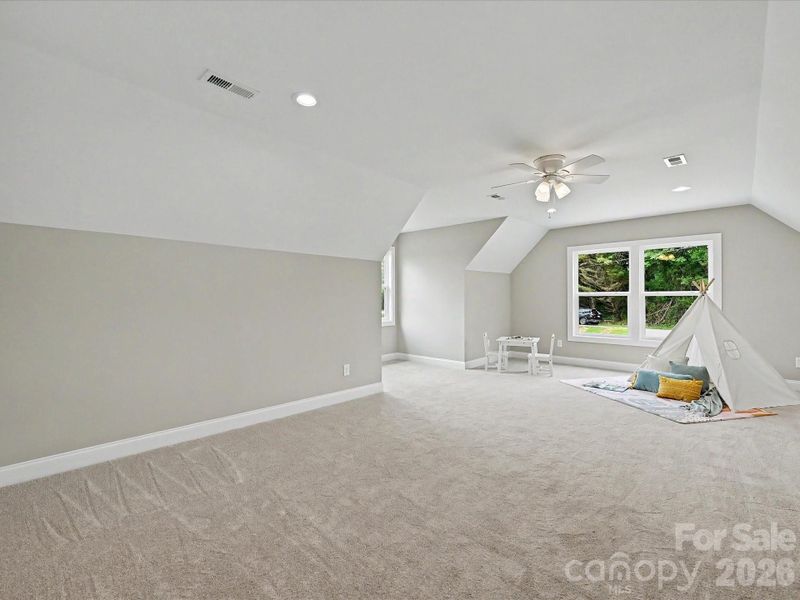 Spacious bonus room offers endless flexibility for a media room, playroom, home gym, or additional living space.