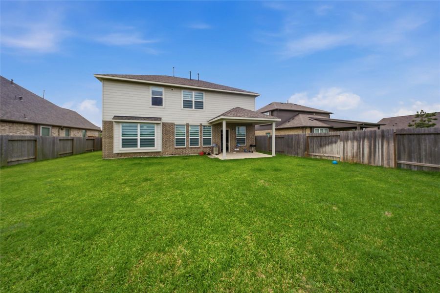 Exterior details and patio area of a home in Sierra Vista, Iowa Colony (Image 3).