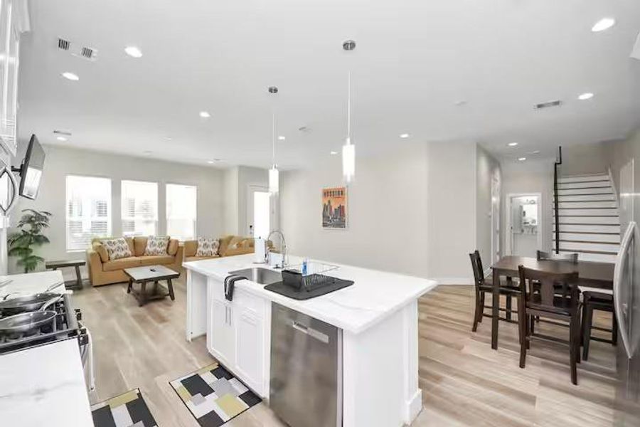This angle shows just how much usable space the first floor offers, with the kitchen, dining, and living areas all working together.