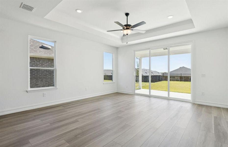 Spacious gathering room with access to backyard