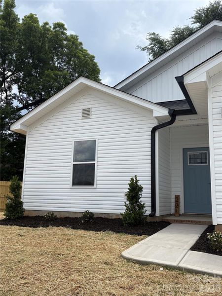Front exterior of a new home in , Concord, NC, highlighting curb appeal (Image 20).