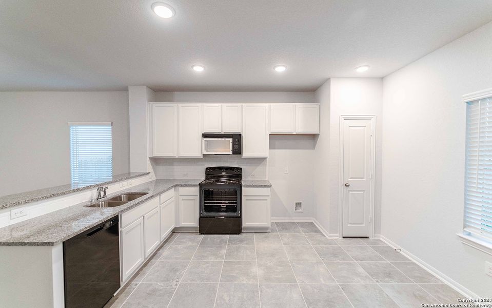 Furnished interior view inside a new home in Hannah Heights, Seguin (Image 5).