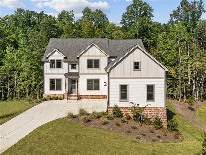 Front exterior of a new home in Arden on Lanier, Cumming, GA, highlighting curb appeal (Image 22).