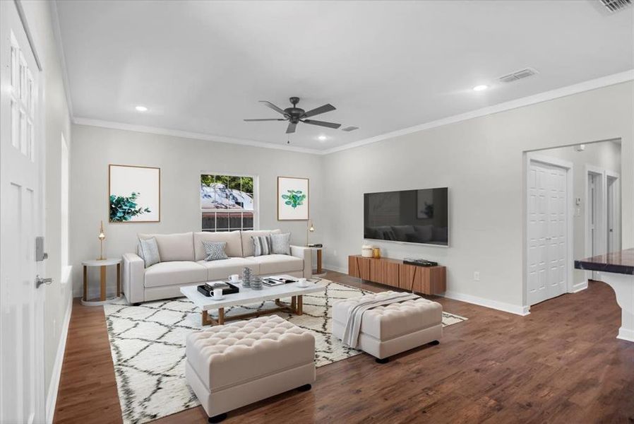 Living area featuring dark wood-style floors, ornamental molding, a ceiling fan, and recessed lighting