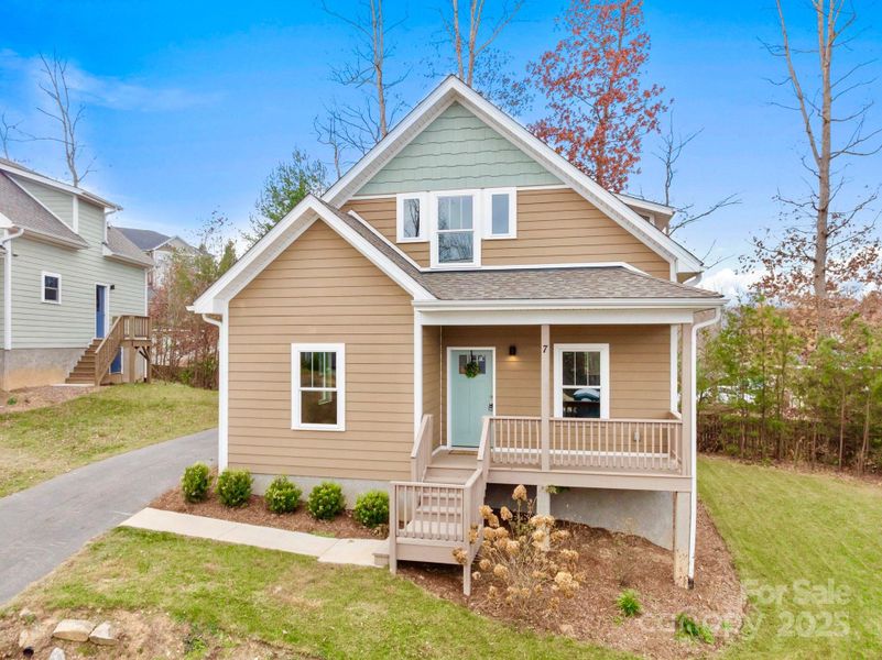Front exterior of a new home in , Arden, NC, highlighting curb appeal (Image 1).