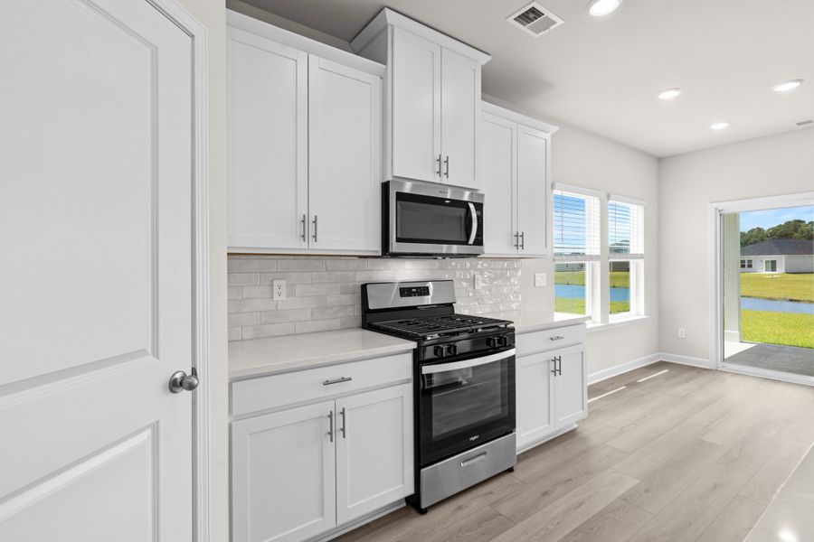 Furnished interior view inside a new home in Cypress Ridge - The Coastline Series, Longs (Image 7).
