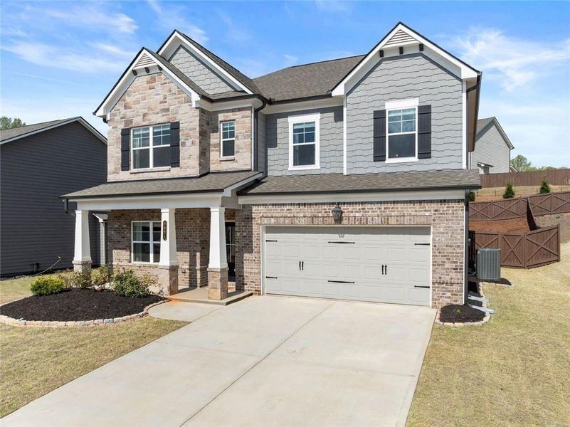 Front exterior of a new home in , Gainesville, GA, highlighting curb appeal (Image 23).