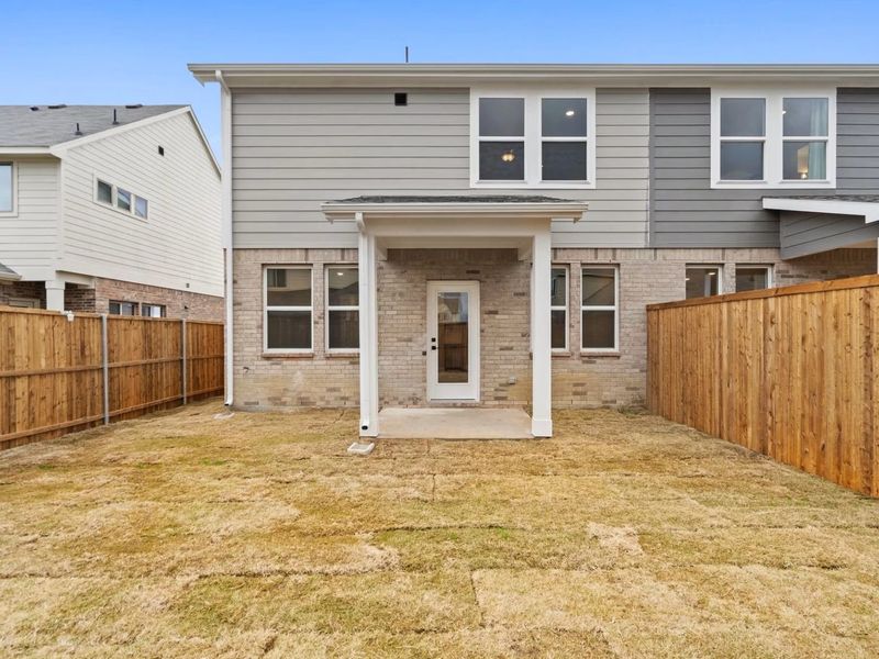 Exterior details and patio area of a home in Lake Park Villas, Wylie (Image 18).