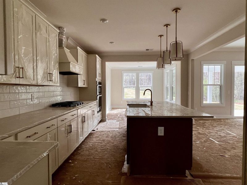 Kitchen with adjoining breakfast/dining room.