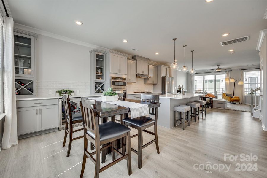 Beautifully designed wet bar, with beverage fridge and ample storage.