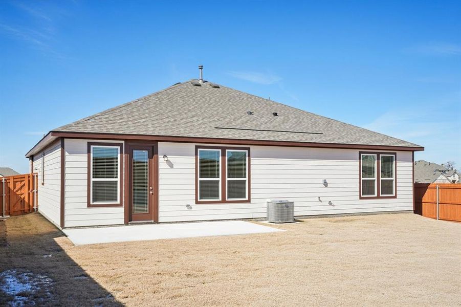 Exterior details and patio area of a home in Heartland Signature, Crandall (Image 18).