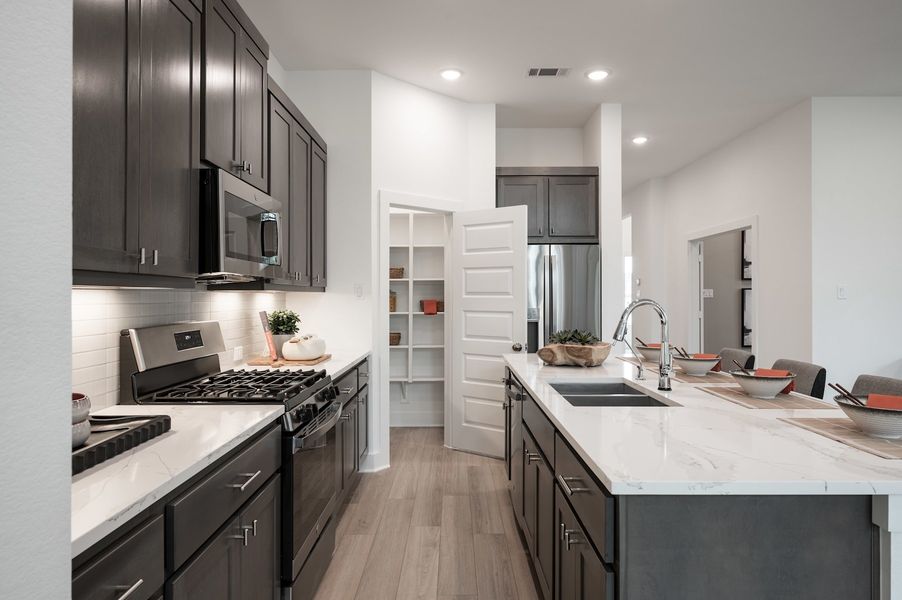 Representative furnished interior of a home built from the Wren by Tri Pointe Homes in Oakhill Reserve, Tomball (Image 11).