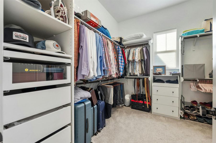 This must-see walk-in closet of your dreams extends off the ensuite bathroom and comes with a custom organizational system.