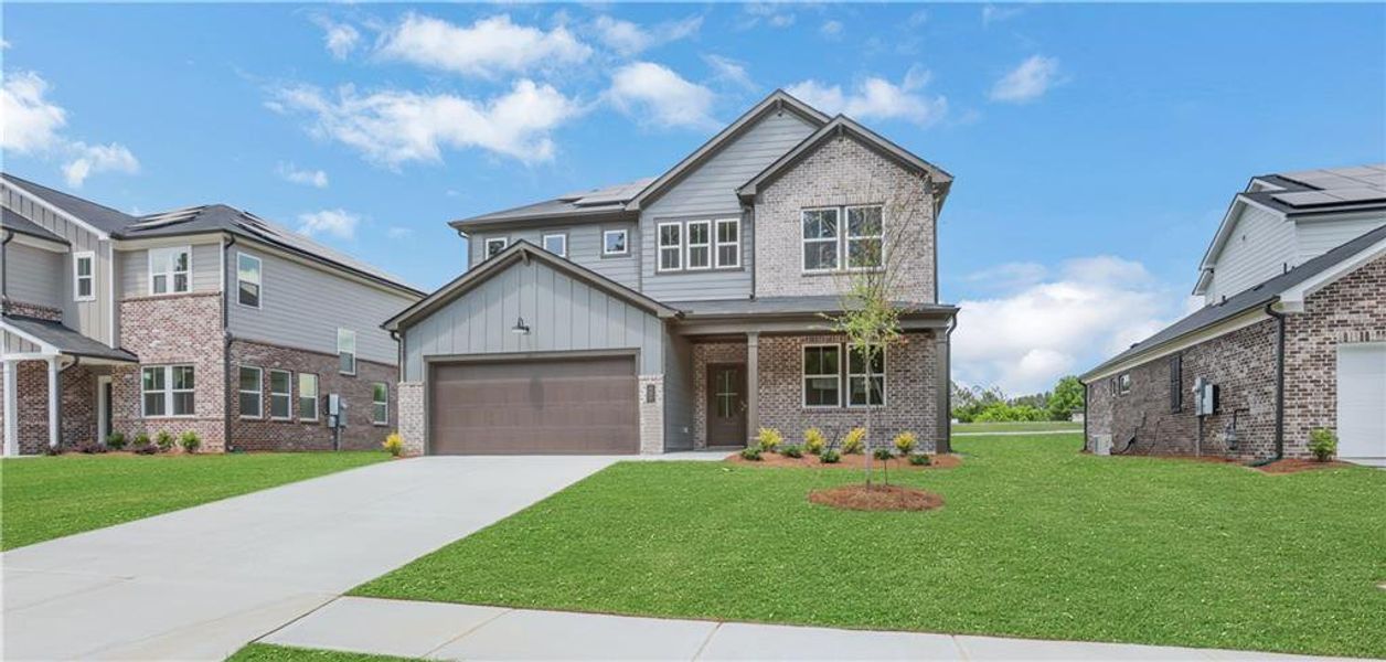Front exterior of a new home in Easton Walk, Lawrenceville, GA, highlighting curb appeal (Image 23). Front exterior of a new home in Easton Walk, Lawrenceville, GA, highlighting curb appeal (Image 23).