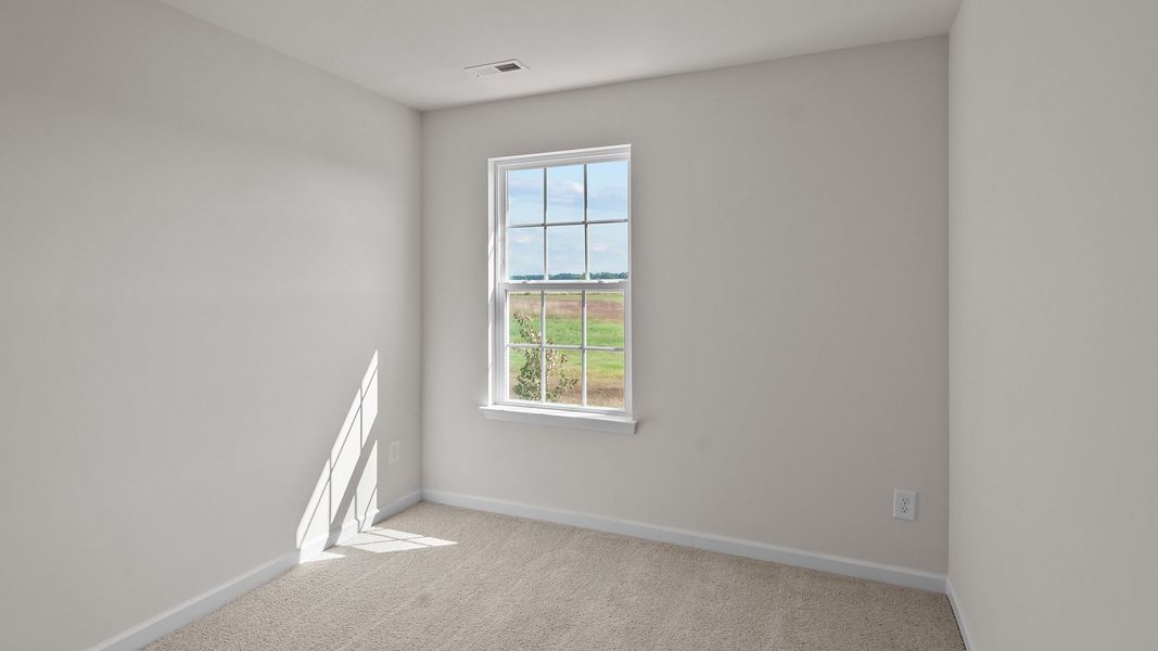 Spacious, unfurnished interior of a new home in Edinborough Townes, Gibsonville (Image 13).