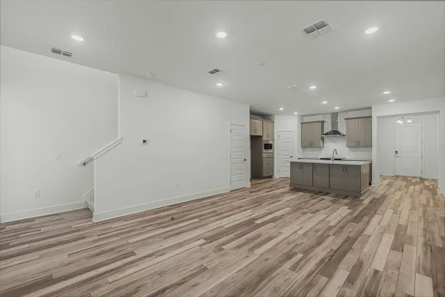 Spacious, unfurnished interior of a new home in Harvest at Ovation - Townhomes, Winter Garden (Image 13).
