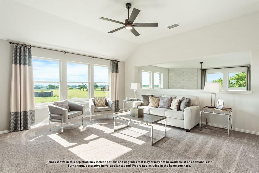 Bright living room with vaulted ceiling, ceiling fan, large windows, and neutral carpet flooring Bright living room with vaulted ceiling, ceiling fan, large windows, and neutral carpet flooring