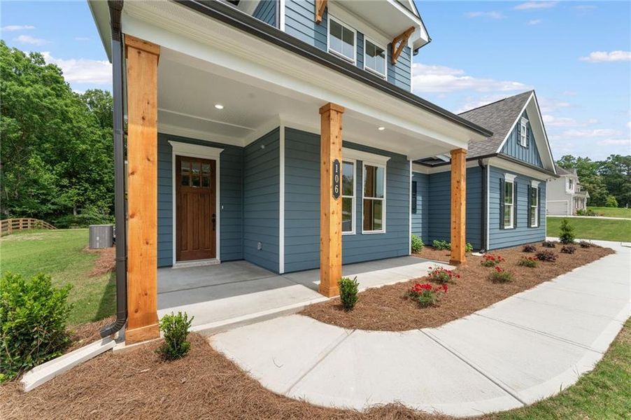 Front exterior of a new home in Oak Valley Estates, Marietta, GA, highlighting curb appeal (Image 2). Front exterior of a new home in Oak Valley Estates, Marietta, GA, highlighting curb appeal (Image 2).