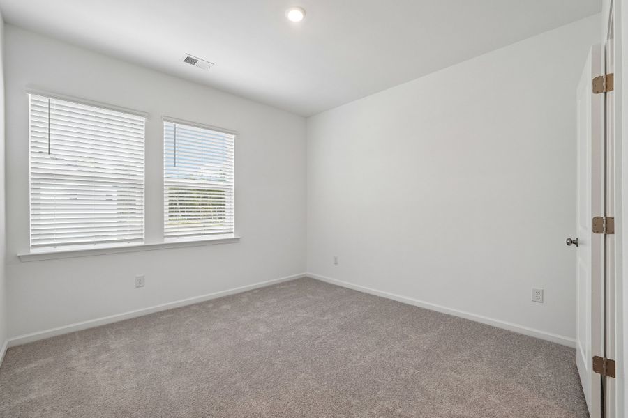 Spacious, unfurnished interior of a new home in Terraces at the Exchange, Indian Land (Image 33).