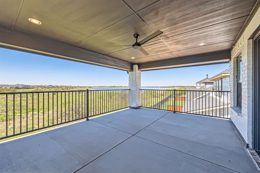 View of patio / terrace featuring a balcony and ceiling fan