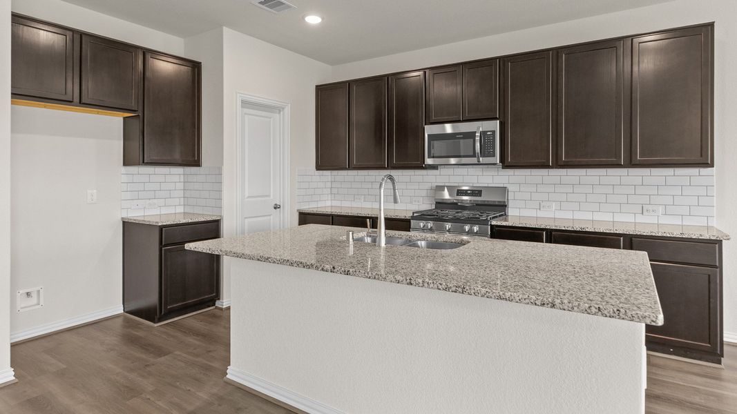 Representative furnished interior of a home built from the Southfork by Brightland Homes in Sunterra, Katy (Image 7).