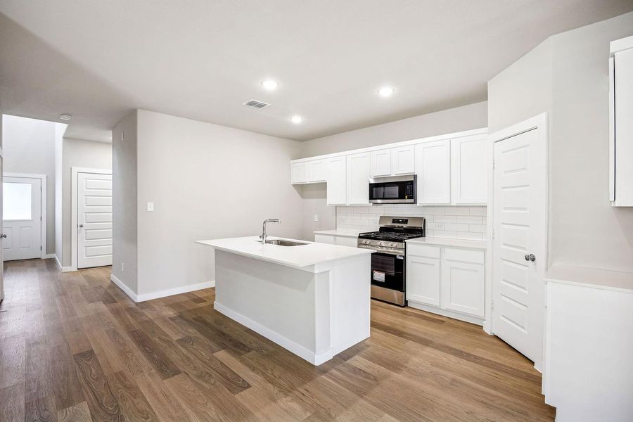 Kitchen in the Willow home plan by Trophy Signature Homes – REPRESENTATIVE PHOTO Kitchen in the Willow home plan by Trophy Signature Homes – REPRESENTATIVE PHOTO