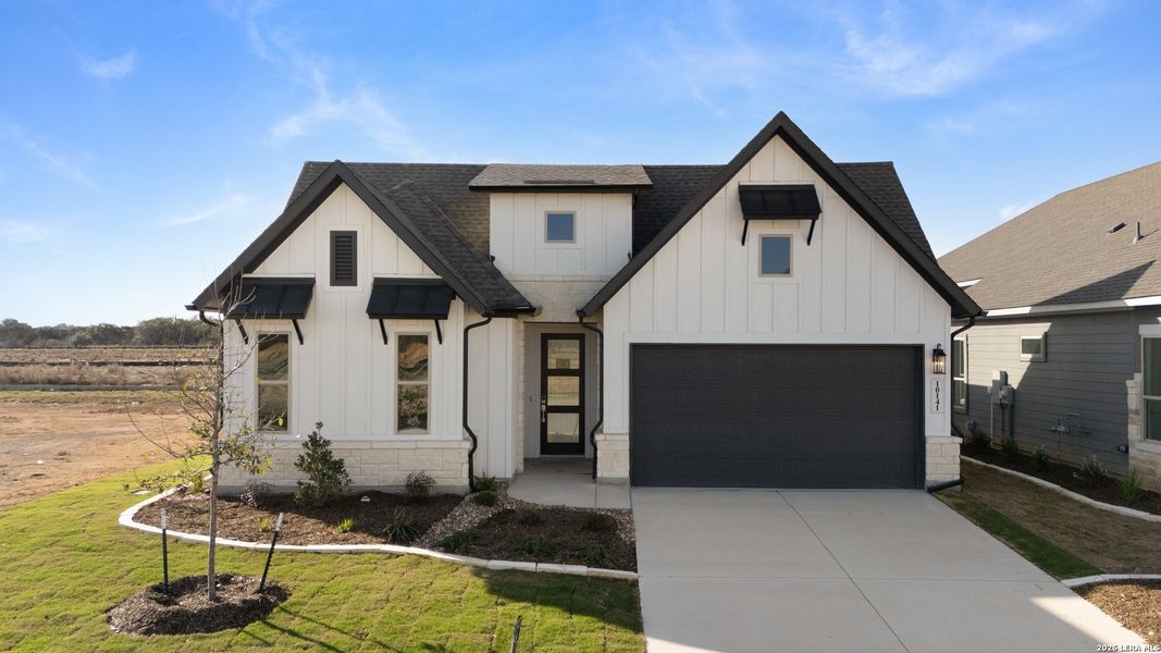 Front exterior of a new home in Davis Ranch, San Antonio, TX, highlighting curb appeal (Image 18).