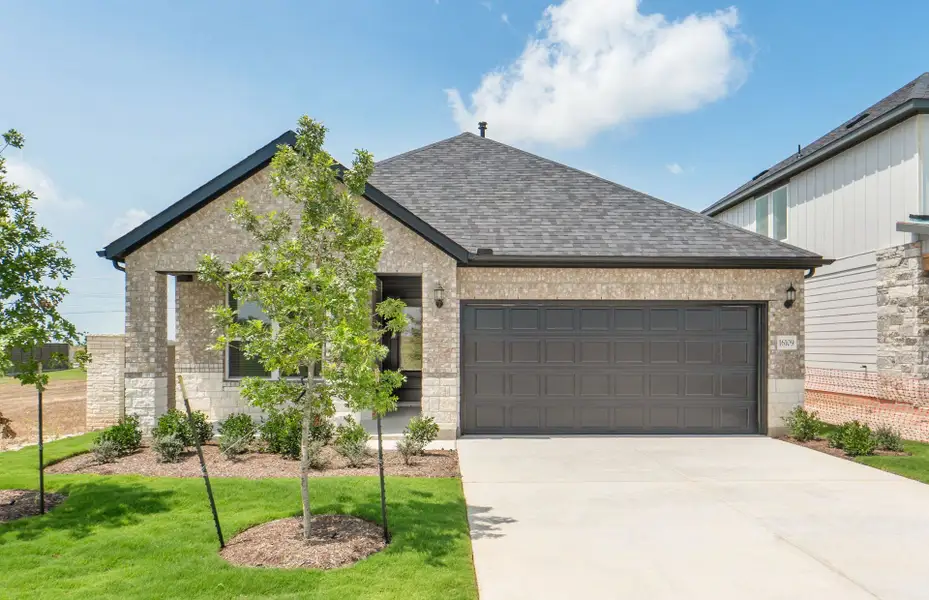 Front exterior of a new home in Kuempel Farms, Pflugerville, TX, highlighting curb appeal (Image 20).