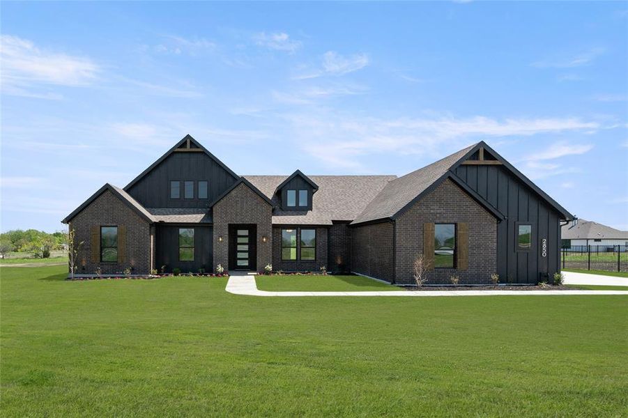 Front exterior of a new home in Carrera Ranch, Waxahachie, TX, highlighting curb appeal (Image 2).