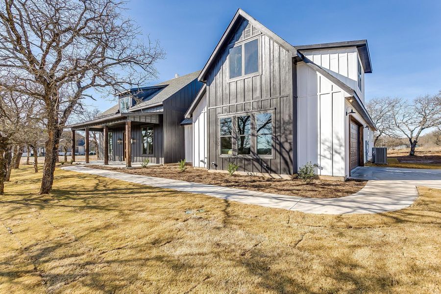 Representative exterior photo of a completed home built from the Erin by Trinity Classic Homes in The Reserve at Shadle, Poolville, TX (Image 26). Representative exterior photo of a completed home built from the Erin by Trinity Classic Homes in The Reserve at Shadle, Poolville, TX (Image 26).