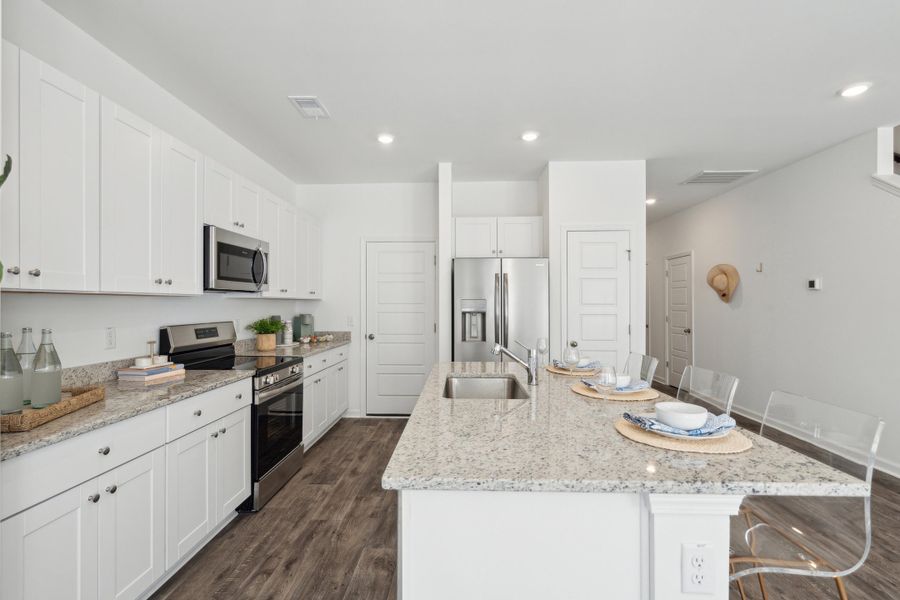 Furnished interior view inside a new home in Lindera Preserve at Cane Bay Plantation: Townhomes, Summerville (Image 3).